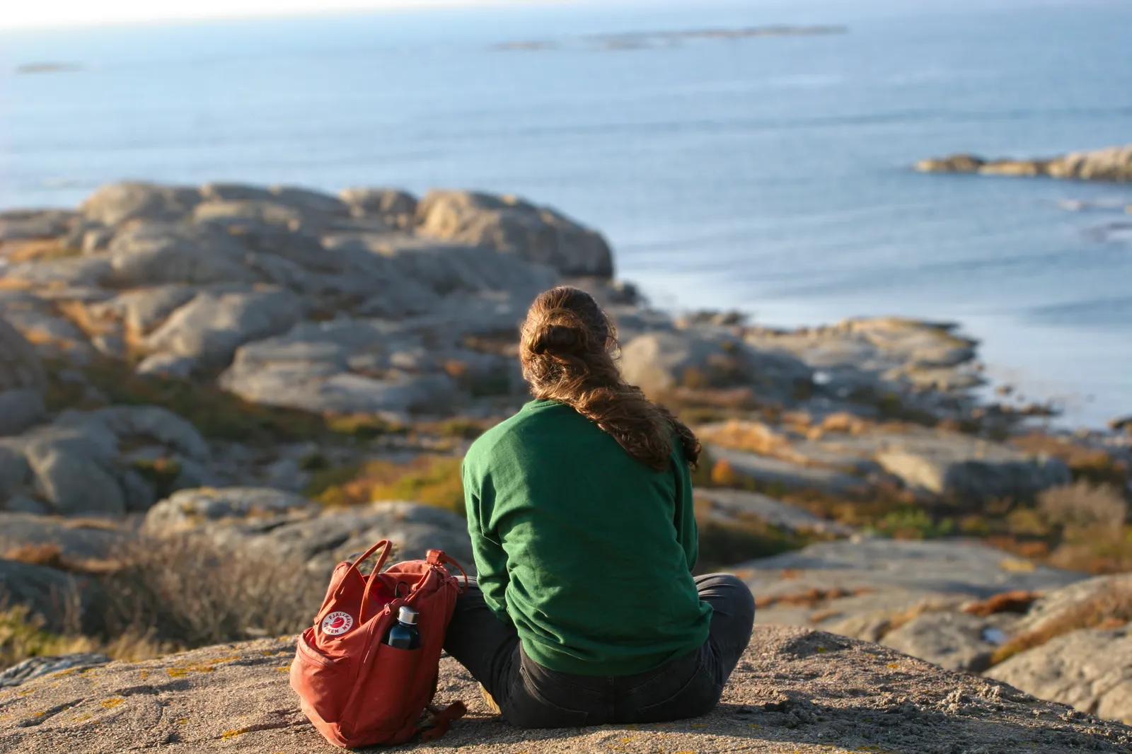 A person sitting on a rock in Hönö, near Gothenburg, Sweden.